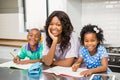 Mother with her children in kitchen Royalty Free Stock Photo