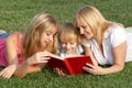 Mother with her children on meadow Royalty Free Stock Photo