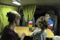 Mother with her children playing colored blocks.