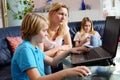 Mother and her children using computer Royalty Free Stock Photo