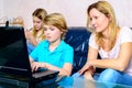 Mother and her children using computer Royalty Free Stock Photo