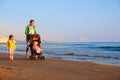 Mother with her daughter and baby on a sandy beach Royalty Free Stock Photo