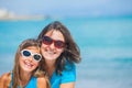 Mother and her daughter having fun on beach