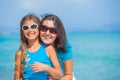 Mother and her daughter having fun on beach