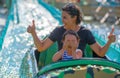 Mother and her daughter having fun in waterpark Royalty Free Stock Photo