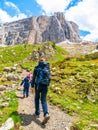 Mother and her daughter hiking in the mountains. Travellig adventre and active vacation with children. Dolomites, Italy Royalty Free Stock Photo