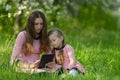 mom and daughter looking at a tablet Royalty Free Stock Photo