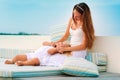 Mother and her daughter relax in sea background