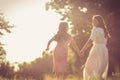 Mother and her daughter are running in the park Royalty Free Stock Photo