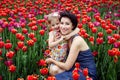 Mother with her daughter on thee flowers field Royalty Free Stock Photo