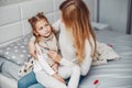 Mother with her illnes daughter in a bedroom