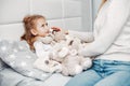 Mother with her illnes daughter in a bedroom