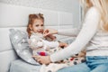 Mother with her illnes daughter in a bedroom