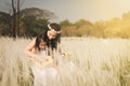 Mother and her kid playing guitar together in meadow nature on sunny day Royalty Free Stock Photo