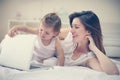 Mother and her little baby at home. Mother with her baby watching something on digital tablet. Royalty Free Stock Photo