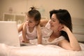 Mother and her little baby at home. Mother with her baby watching something on digital tablet. Royalty Free Stock Photo