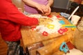 mother and her little baby making hands cookies at home in the kitchen Royalty Free Stock Photo