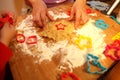 Mother and her little baby making hands cookies at home in the kitchen Royalty Free Stock Photo