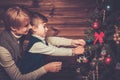 Mother and her little boy decorating christmas tree Royalty Free Stock Photo