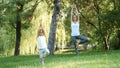 Mother and her little cute daughter doing yoga exercise together