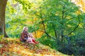 Mother and her little daughter at beautiful autumn park Royalty Free Stock Photo