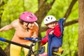 Mother and her little girl sitting in bike seat Royalty Free Stock Photo