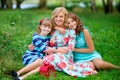 Mother with her lovely daughters in the park Royalty Free Stock Photo