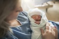 Mother with her newborn baby at the hospital a day after a natural birth labor Royalty Free Stock Photo