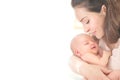 Mother and her Newborn Baby together. Love. Happy Mother and Baby kissing and hugging. High key soft image of Beautiful Family Royalty Free Stock Photo