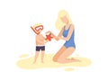 Mother and Her Son on Beach, Cute Boy in Diving Mask Holding Starfish, Happy Mom and Son Enjoying Summer Vacation on Royalty Free Stock Photo