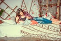 Mother with her son in bed, christmas background. Christmas Eve. Mother reading to her son bedtime story. New Year at home with Royalty Free Stock Photo