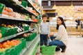 Mother and her son buying fruits at a farmers market Royalty Free Stock Photo