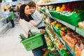 Mother and her son buying fruits at a farmers market Royalty Free Stock Photo