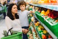 Mother and her son buying fruits at a farmers market Royalty Free Stock Photo