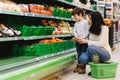 Mother and her son buying fruits at a farmers market Royalty Free Stock Photo