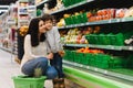 Mother and her son buying fruits at a farmers market Royalty Free Stock Photo