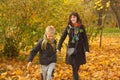 Mother and her son child boy walking in autumn park Royalty Free Stock Photo