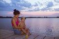 Mother with her son enjoy the beautiful sunset Royalty Free Stock Photo