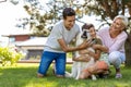 Mother and her sons playing with their dog Royalty Free Stock Photo