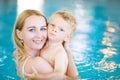 Mother and her toddler son swiming in the pool Royalty Free Stock Photo