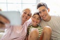 Mother with her two sons taking selfie