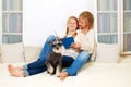 Mother with her 10 years old kid girl reading the book Royalty Free Stock Photo