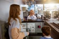 Mother and his son at airport checkin desk leaving on trip