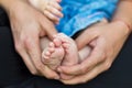 Mother gently hold baby leg in hand Royalty Free Stock Photo