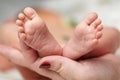 Mother hold feets of newborn baby Royalty Free Stock Photo