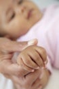 Mother Holding Baby Daughter's Hand Royalty Free Stock Photo