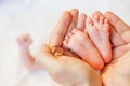 Mother holding baby feet at hands Royalty Free Stock Photo