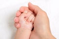 Mother holding a baby hand