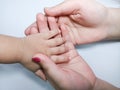 Mother Holding Child Hand With Care and Love Royalty Free Stock Photo