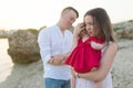 Mother holding cute baby girl outdoors on the beach Royalty Free Stock Photo